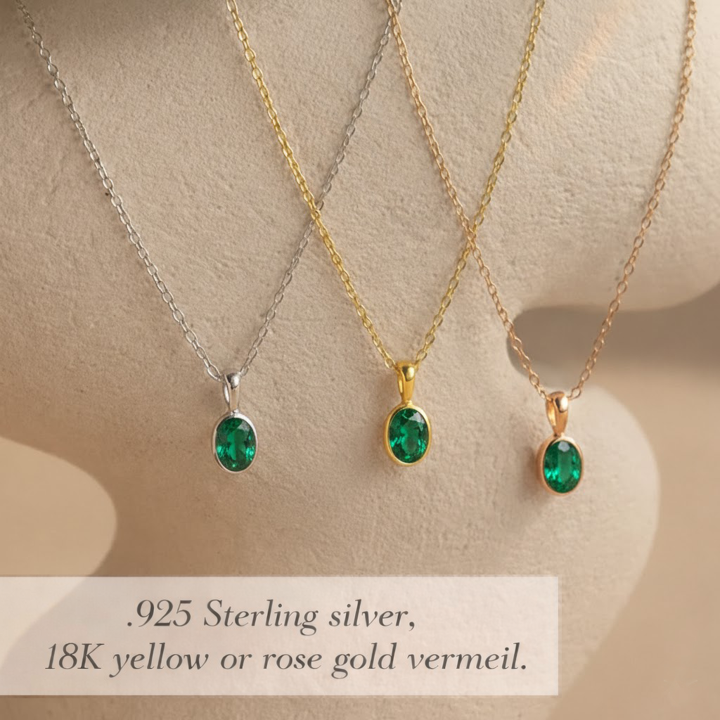 Oval cut green emerald birthstone bezel pendant necklaces displayed in sterling silver, 18k yellow gold vermeil, and rose gold vermeil finishes, featuring dainty oval gemstone charms on delicate chains, minimalist birthstone jewelry for women, custom birthstone necklace gift for birthday, Valentine’s Day, anniversary, or everyday layering jewelry.