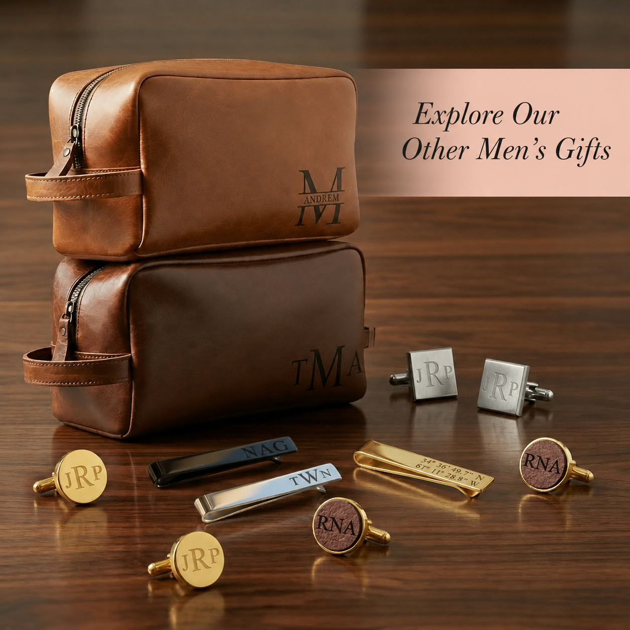 Brown leather toiletry bag with personalized monograms on a wooden surface, surrounded by cufflinks and tie bars.