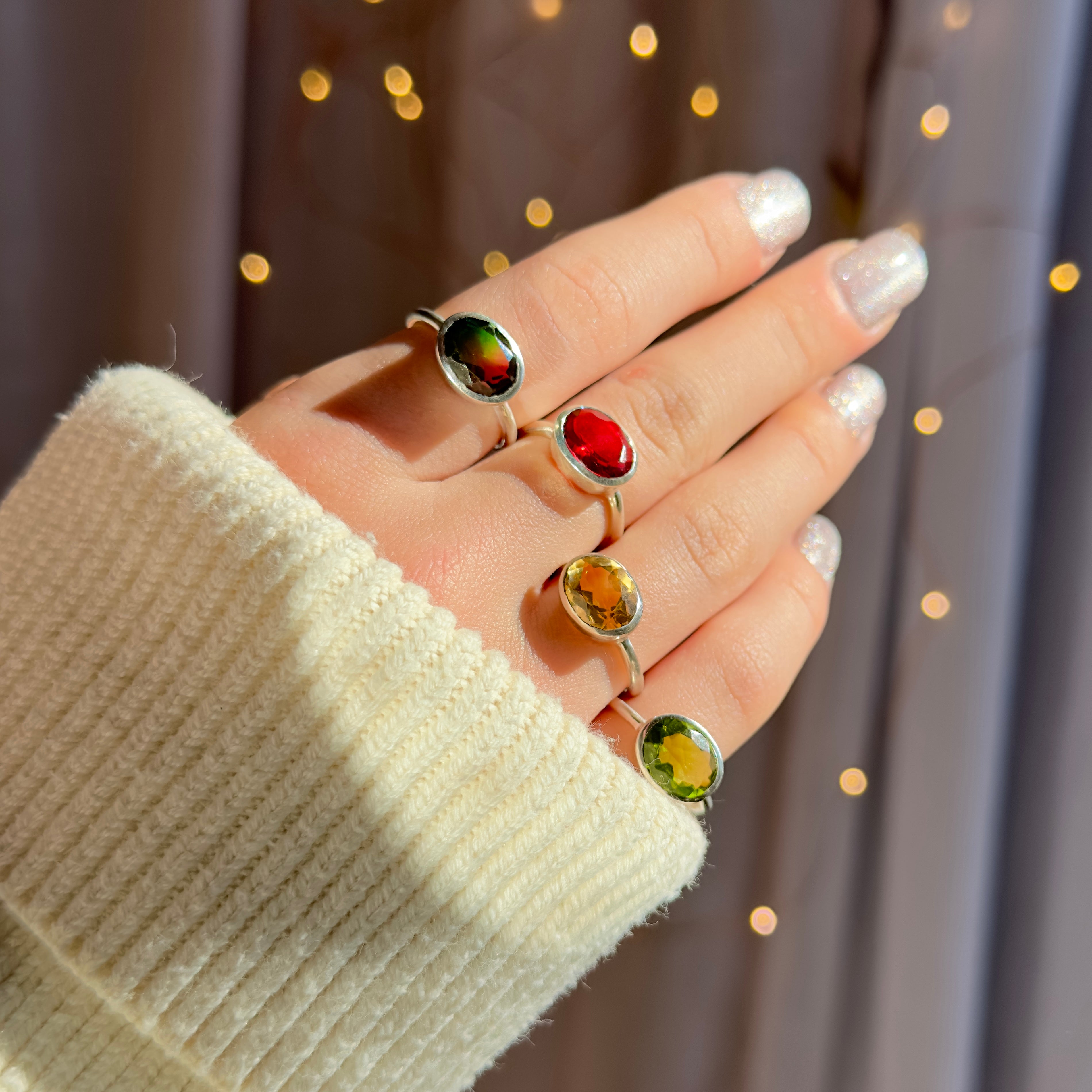 Handcrafted sterling silver gemstone rings with vibrant oval-cut stones in green, red, yellow, and golden hues. Stackable gemstone jewelry perfect for everyday wear, boho chic fashion, or as personalized birthstone rings for women. Unique handmade artisan rings ideal for birthdays, anniversaries, graduation gifts, or holiday presents. Colorful gemstone statement rings designed for minimalists who love bold, modern, and elegant jewelry styles.