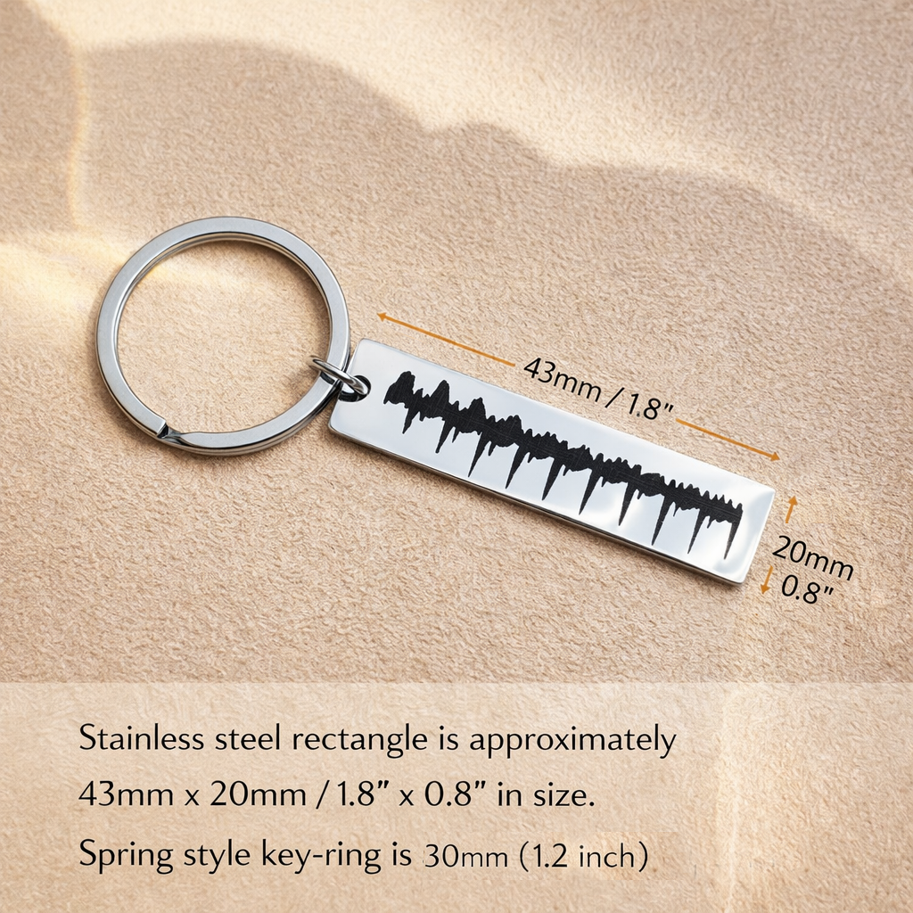 Size chart showing dimensions of stainless steel heartbeat keychain, including rectangular engraved plate and key ring. Personalized ultrasound heartbeat keychain with clearly labeled measurements.