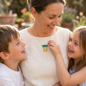Personalized mother’s birthstone necklace featuring three horizontal baguette stones in green, yellow, and clear gemstone colors.
