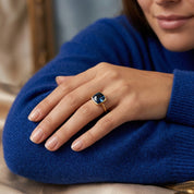 Kyanite statement ring worn on hand with silver band and rich blue cushion stone