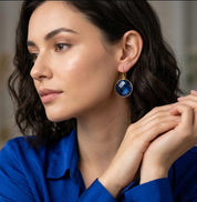 Blue kyanite earrings on model, gold teardrop gemstone drop earrings, elegant September birthstone jewelry