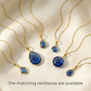 Matching blue kyanite necklaces and earrings in gold, coordinated September birthstone jewelry set