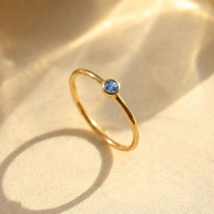 Dainty kyanite ring in gold vermeil, sapphire blue September birthstone stacking ring on soft neutral background