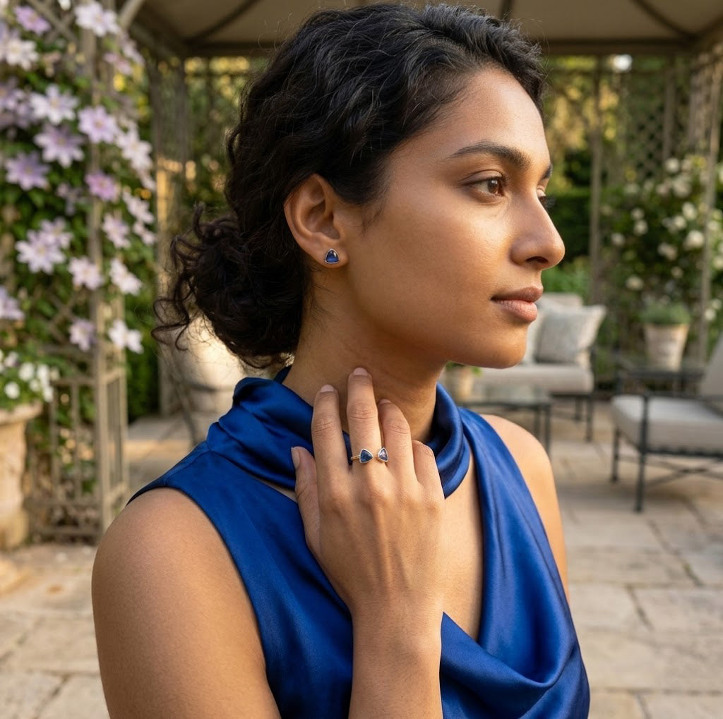 Woman wearing blue kyanite stud earrings gold dainty everyday jewelry