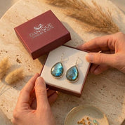 Labradorite earrings presented in a Danique Jewelry gift box, showing natural blue-green gemstone drops packaged beautifully for gifting.