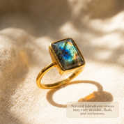 Natural labradorite ring with blue flash and unique stone inclusions.