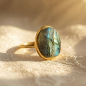 Gold vermeil rough cut labradorite ring showing organic teardrop stone profile and natural green blue flash