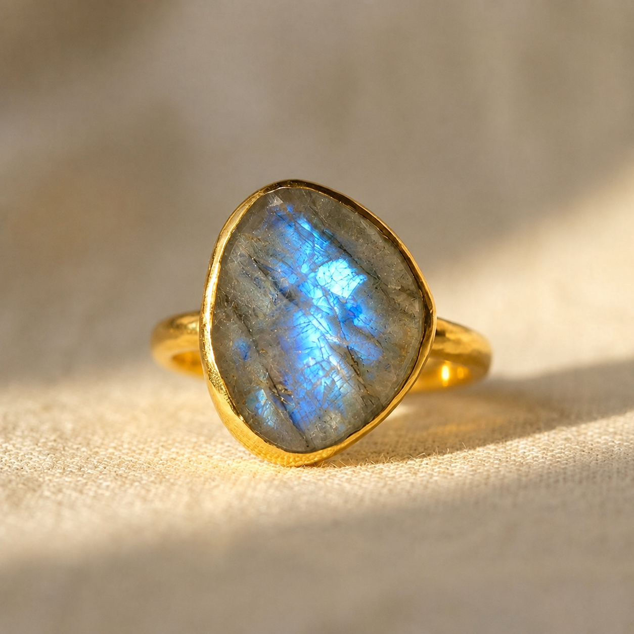 Natural rough cut labradorite teardrop ring in 18K yellow gold vermeil with vivid blue iridescent flash
