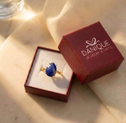 Danique Jewelry gift box with lapis lazuli teardrop ring, packaged as a meaningful blue gemstone gift for her.
