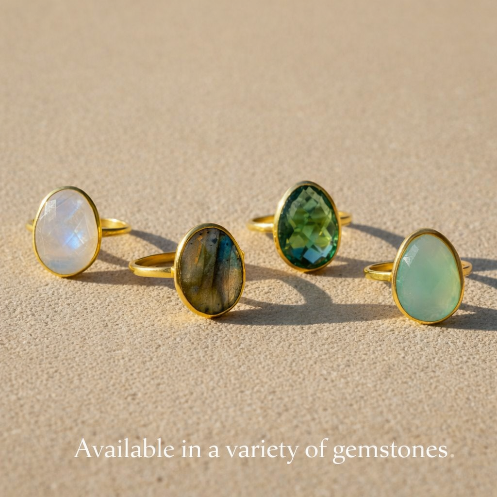 Green tourmaline ring shown alongside moonstone and labradorite gemstone rings, oval bezel set birthstone ring collection in gold vermeil