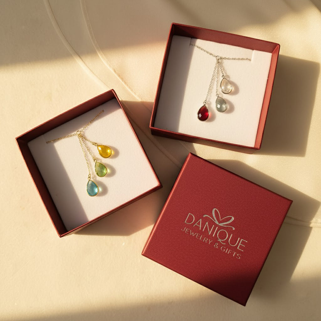 Danique Jewelry gift packaging with red jewelry boxes and personalized birthstone necklaces, ready-to-gift family necklace presentation for mom or grandma