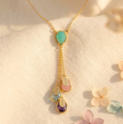 Personalized lariat birthstone necklace with kids names and colorful teardrop gemstones

