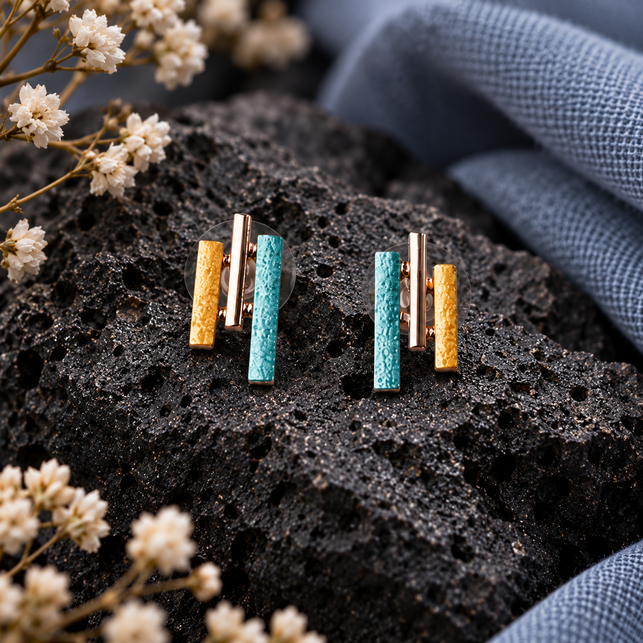 Boho Sunray stud earrings with turquoise gold silver and rose gold geometric bars on dark stone

