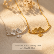 Personalized lovebirds family necklaces displayed in bright silver and yellow gold finishes.
