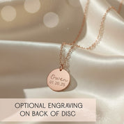 Round monogram disc necklace showing optional back engraving with custom message or date, paired with swirly front monogram in elegant script. Personalized monogram pendant available in sterling silver, yellow gold-filled or rose gold-filled, perfect for sentimental gifting to Mom, Grandma, sister or bridesmaids. A timeless custom keepsake for birthdays, Mother’s Day, weddings, anniversaries or holiday gifting with high-quality engraving on both sides.