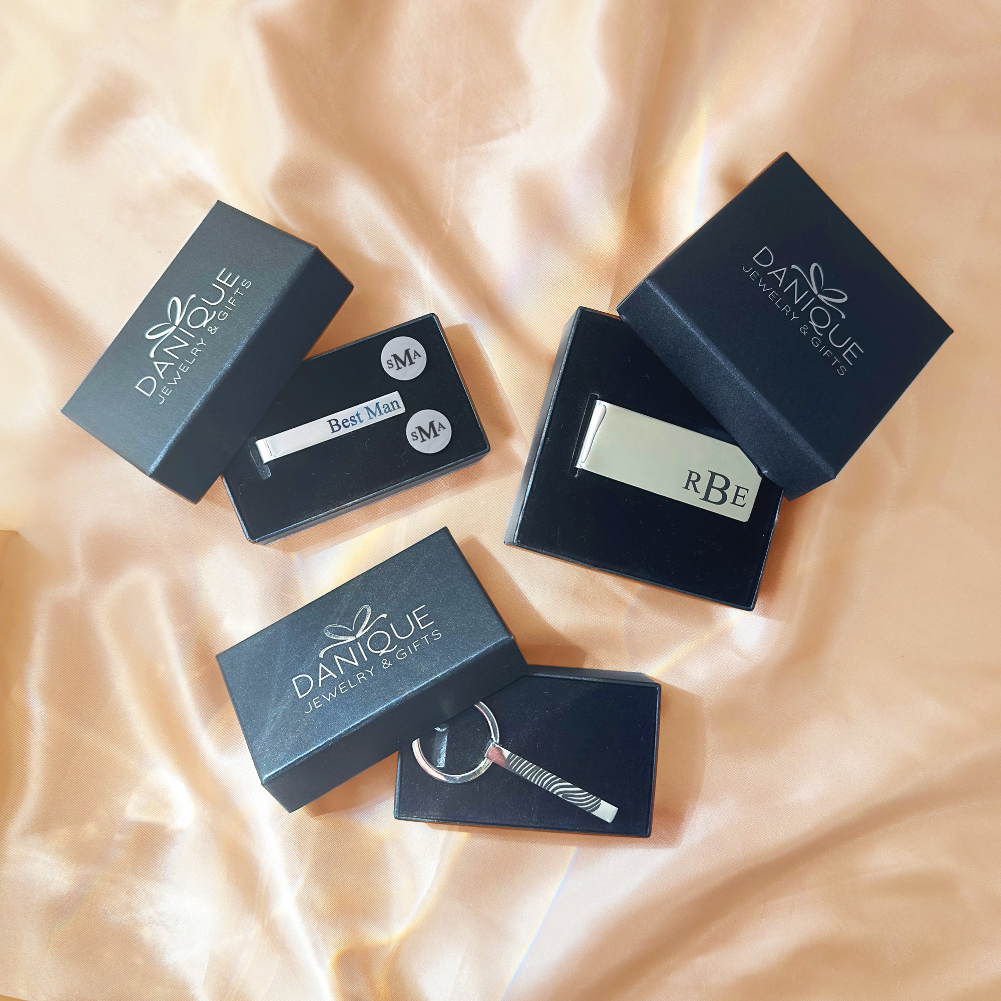 Personalized gifts for men including engraved money clip, monogram cufflinks, custom tie bar, and fingerprint keychain, all presented in Danique Jewelry gift boxes. Perfect gift ideas for dad, husband, boyfriend, groomsmen, best man, or boss. Ideal for Father’s Day, Christmas, wedding day, anniversary, or graduation. Thoughtful keepsake gifts handcrafted in high-quality materials, ready for gifting.