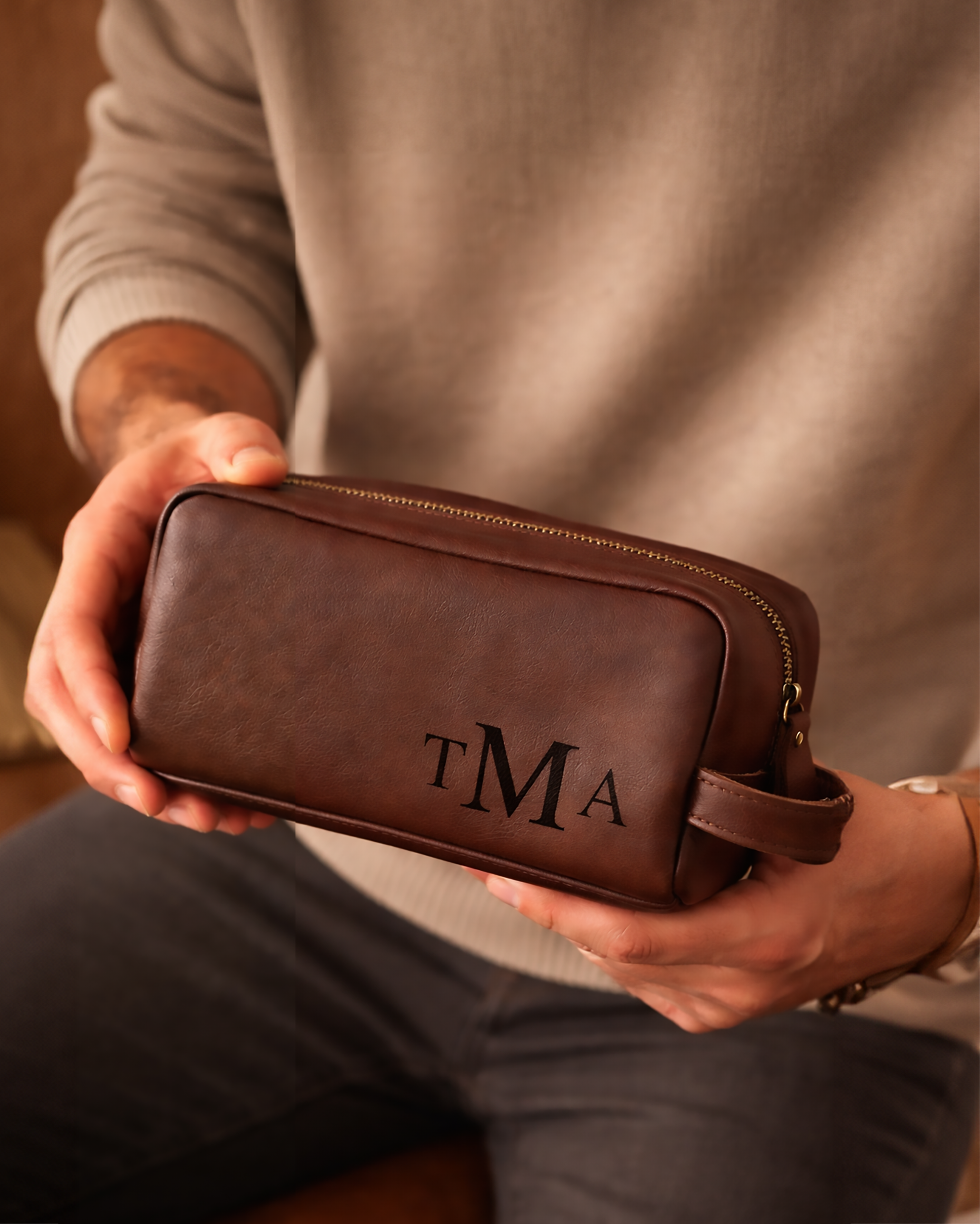 men_s-toiletry-bag-in-man_s-hand.png