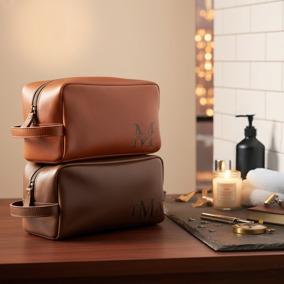 Engraved men's toiletry bag, personalized dopp kit, custom men's Rustic men’s leather toiletry bags engraved with initials, photographed against wood and seasonal décor. Perfect Christmas gift idea for men, husbands, or groomsmen.