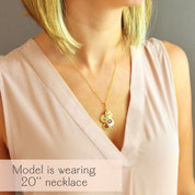 Woman wearing a personalized mom or grandma necklace with engraved name discs and natural birthstones on a delicate chain. A meaningful everyday keepsake for moms, grandmothers, and mothers-in-law, perfect for gifting on Mother’s Day, birthdays, or as new grandma gifts.