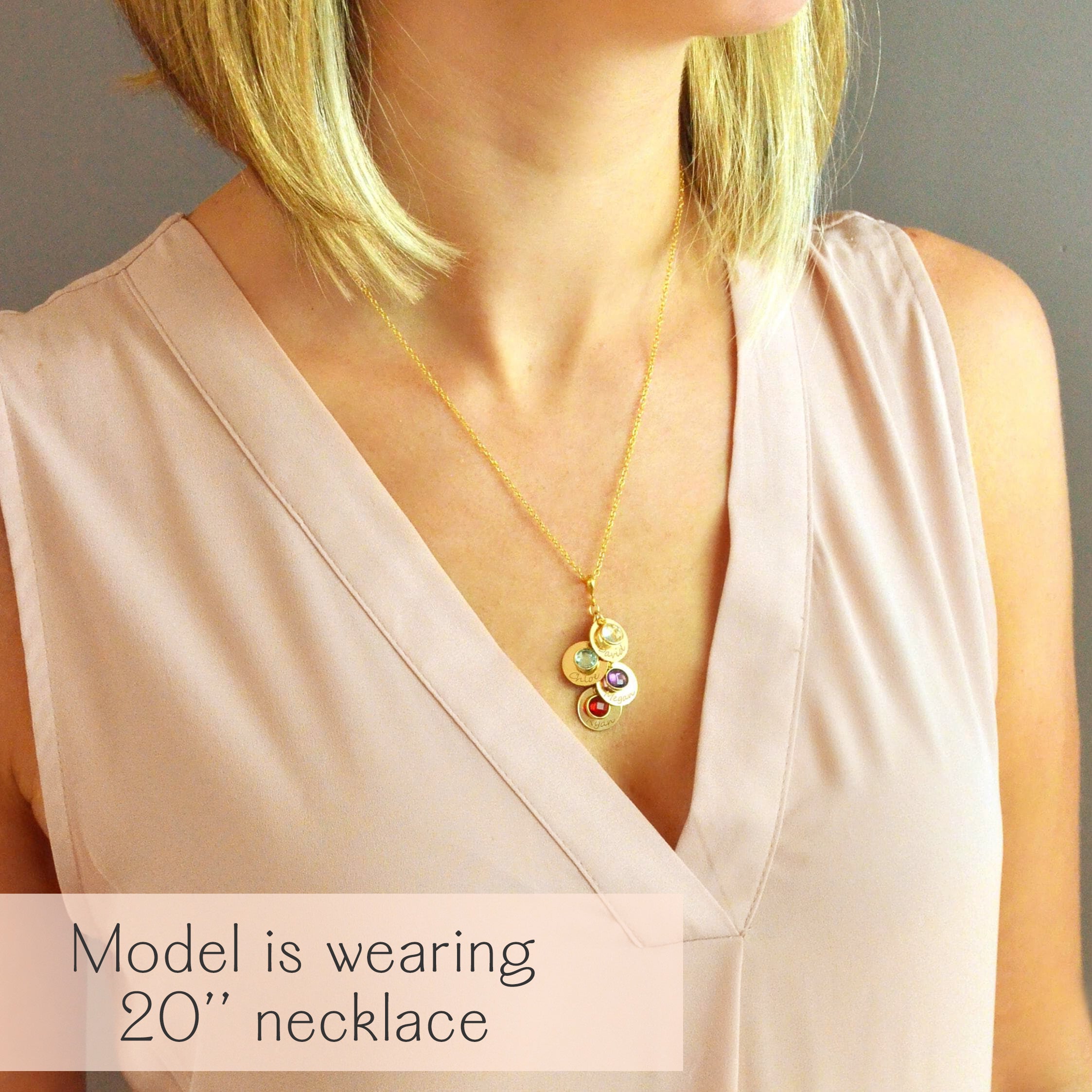 Woman wearing a personalized mom or grandma necklace with engraved name discs and natural birthstones on a delicate chain. A meaningful everyday keepsake for moms, grandmothers, and mothers-in-law, perfect for gifting on Mother’s Day, birthdays, or as new grandma gifts.