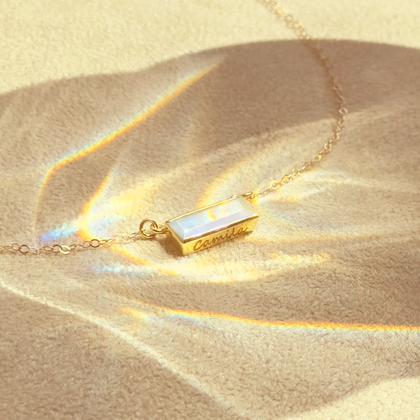 June Birthstone rainbow moonstone horizontal bar necklace with a gold filled chain.