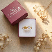 Personalized moonstone ring displayed in Danique Jewelry signature gift-ready packaging.
