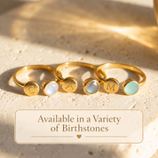 Adjustable personalized birthstone rings shown with moonstone and other gemstone colors.
