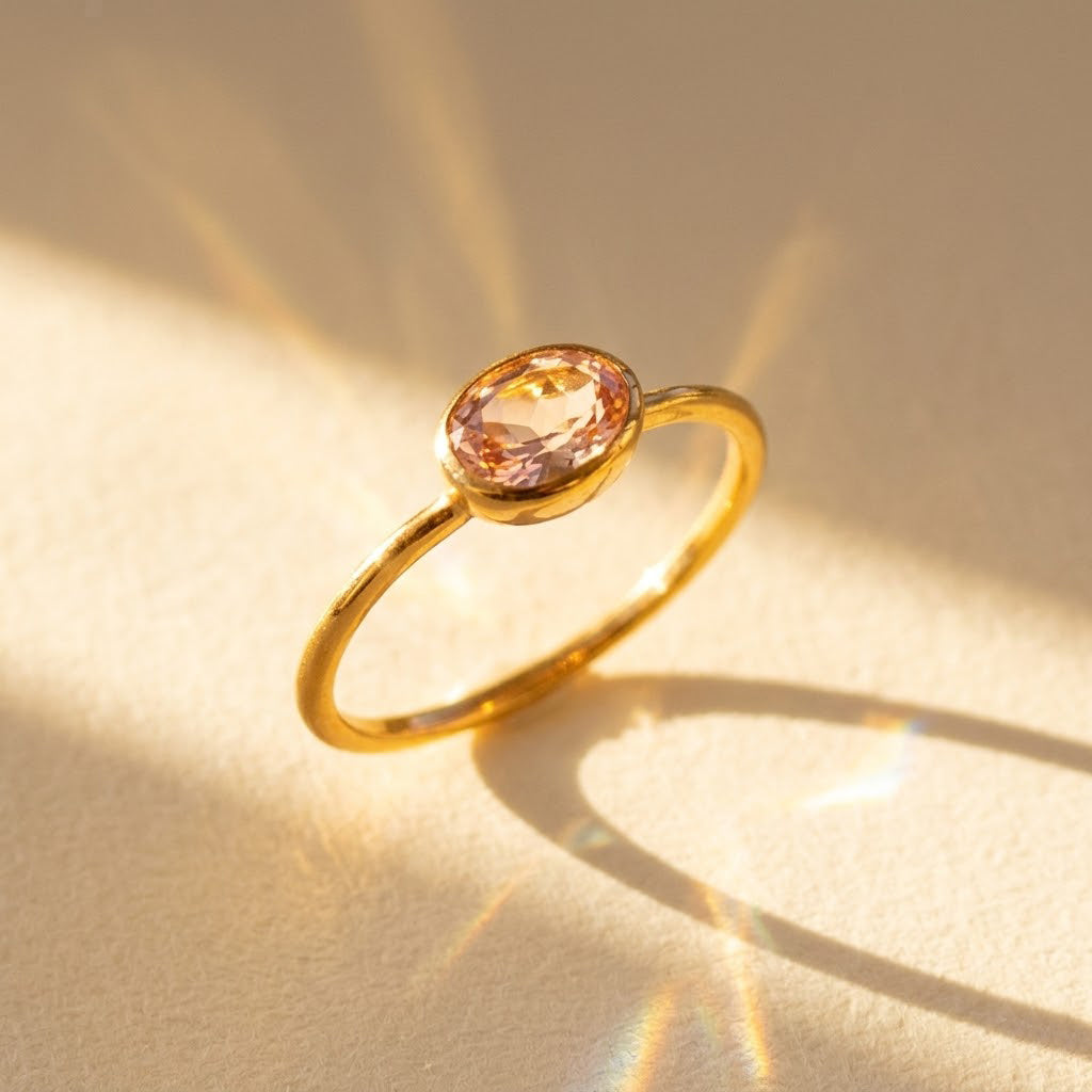 a gold morganite ring shown on white background. stackable! Stacking rings, bezel set, small oval, tiny oval, dainty oval, birthstone rings, sterling silver stamp, birthstone ring, birthstone jewelry, stack set, stacking rings, gemstone ring, birthstone ring, mother's day gift for her, gift for mom, gift for fiance, gift for girlfriend, wedding jewelry, bridesmaid jewelry, anniversary jewelry, anniversary gift, birthday gift, christmas gift, valentine's day gift, valentine's day rings, cocktail ring