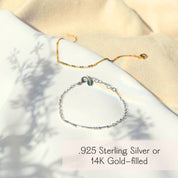 Minimalist Morse code bracelet in sterling silver and 14K gold filled, photographed together on a soft fabric background. This dainty hidden message bracelet encodes a secret word in Morse code beads, making it a meaningful long distance friendship bracelet or anniversary jewelry gift. A perfect personalized bracelet gift for boyfriend or girlfriend, ideal for birthdays, Valentine’s Day, Mother’s Day, or “just because” occasions.