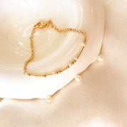 Gold morse code bead bracelet with pearl spacers. delicate bracelets, gold and silver, with small beads spaced evenly along the length of each bracelet. Pinky promise. Morse code bead jewelry, morse code beaded jewelry, secret message jewelry, bff jewelry, bff bracelet, pinky promise bracelet, secret message bracelet, hidden message jewelry, hidden message bracelet, sterling silver, gold, adjustable bracelets, delicate bead bracelet, new product, delicate pattern of dots and dashes bracelet