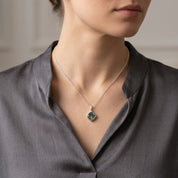 minimalist necklace with natural gemstone in gold setting, simple and refined jewelry piece