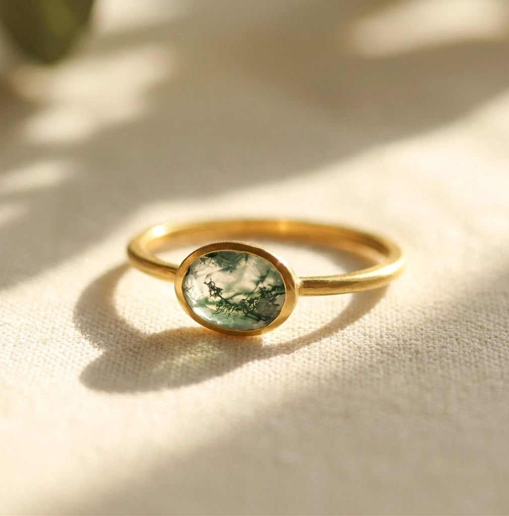a gold moss agate ring shown on white background. stackable! Stacking rings, bezel set, small oval, tiny oval, dainty oval, birthstone rings, sterling silver stamp, birthstone ring, birthstone jewelry