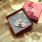 Gift-ready personalized mom necklace with kids names and birthstones in Danique Jewelry gift box