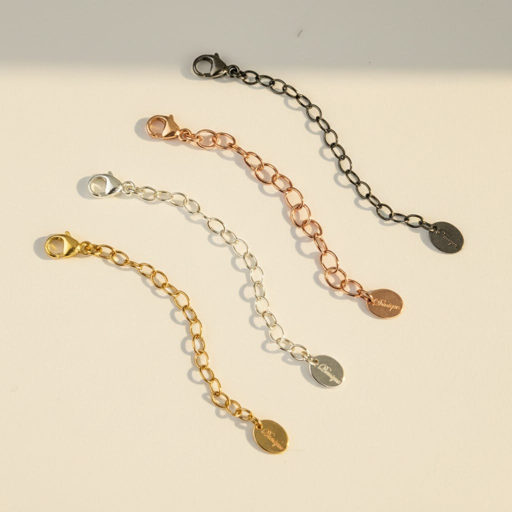 Four necklace extender chains in sterling silver, gold, rose gold, and oxidized finishes with flat disc details. Adjustable length between 1–6 inches for the perfect jewelry fit. Great for extending short necklaces, chokers, or bracelets. Handmade jewelry accessory gift for women, moms, and friends.
