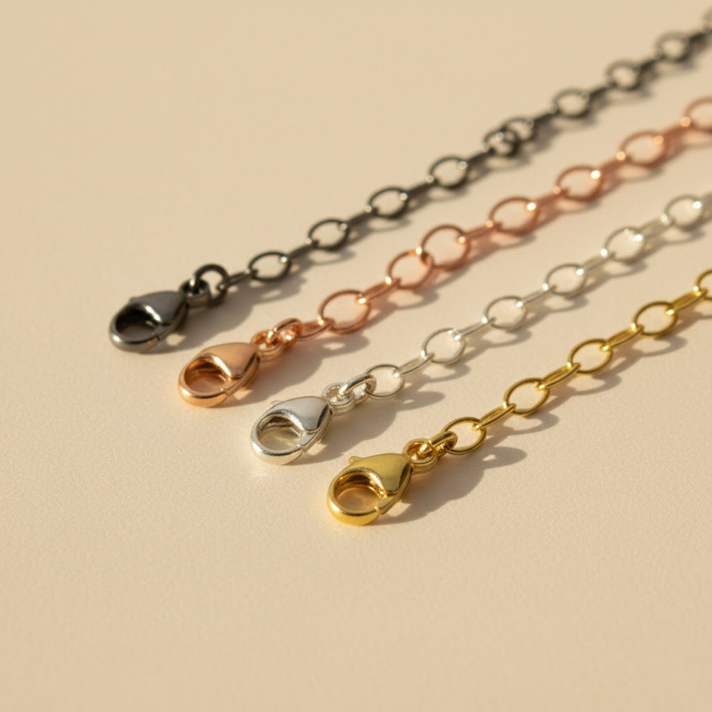 Close-up of necklace extenders in gold, silver, rose gold, and oxidized black, showcasing lobster clasp detail. Adjustable chain extension for necklaces and bracelets, adding 1–6 inches. Perfect minimalist jewelry accessory for everyday wear or gifting occasions.