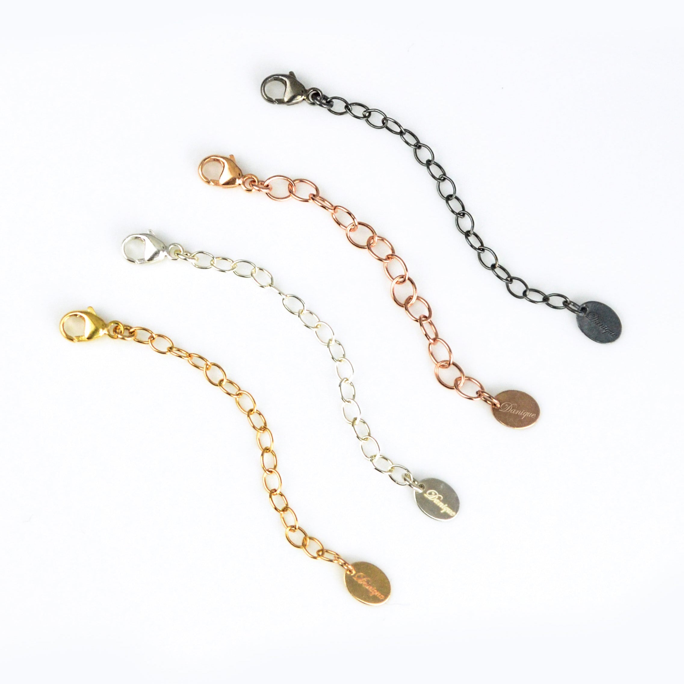 Four necklace extender chains in sterling silver, gold, rose gold, and oxidized finishes with flat disc details. Adjustable length between 1–6 inches for the perfect jewelry fit. Great for extending short necklaces, chokers, or bracelets. Handmade jewelry accessory gift for women, moms, and friends.