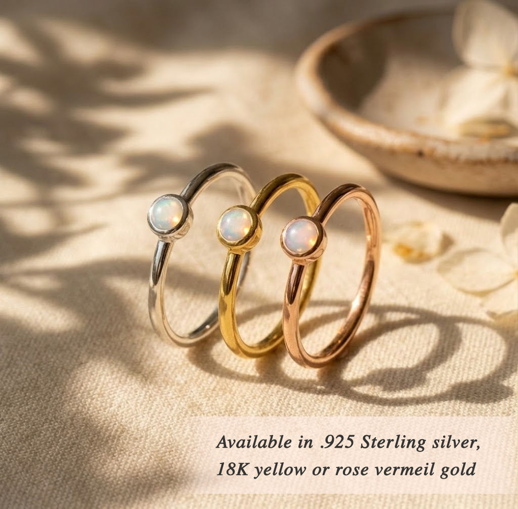 Gold fire opal ring stacked with colorful birthstone rings