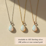 Three opalite teardrop necklaces in silver and gold tones on linen, iridescent opal-look stones, minimalist matching set idea for bridesmaids, sisters, or best friends.