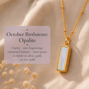 October birthstone image
Opalite October birthstone necklace with iridescent vertical baguette pendant in yellow gold.

