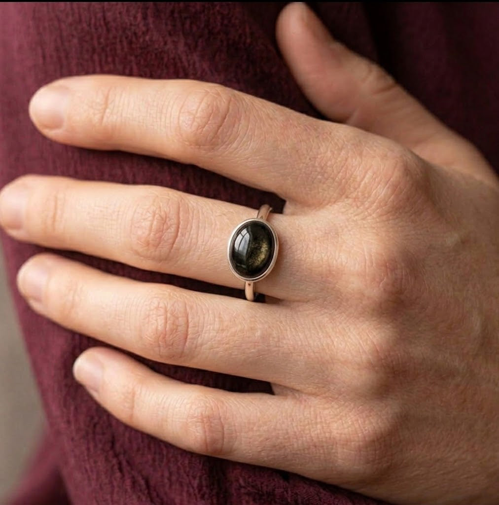 Model wearing black obsidian cabochon ring as a minimalist gemstone ring gift for her