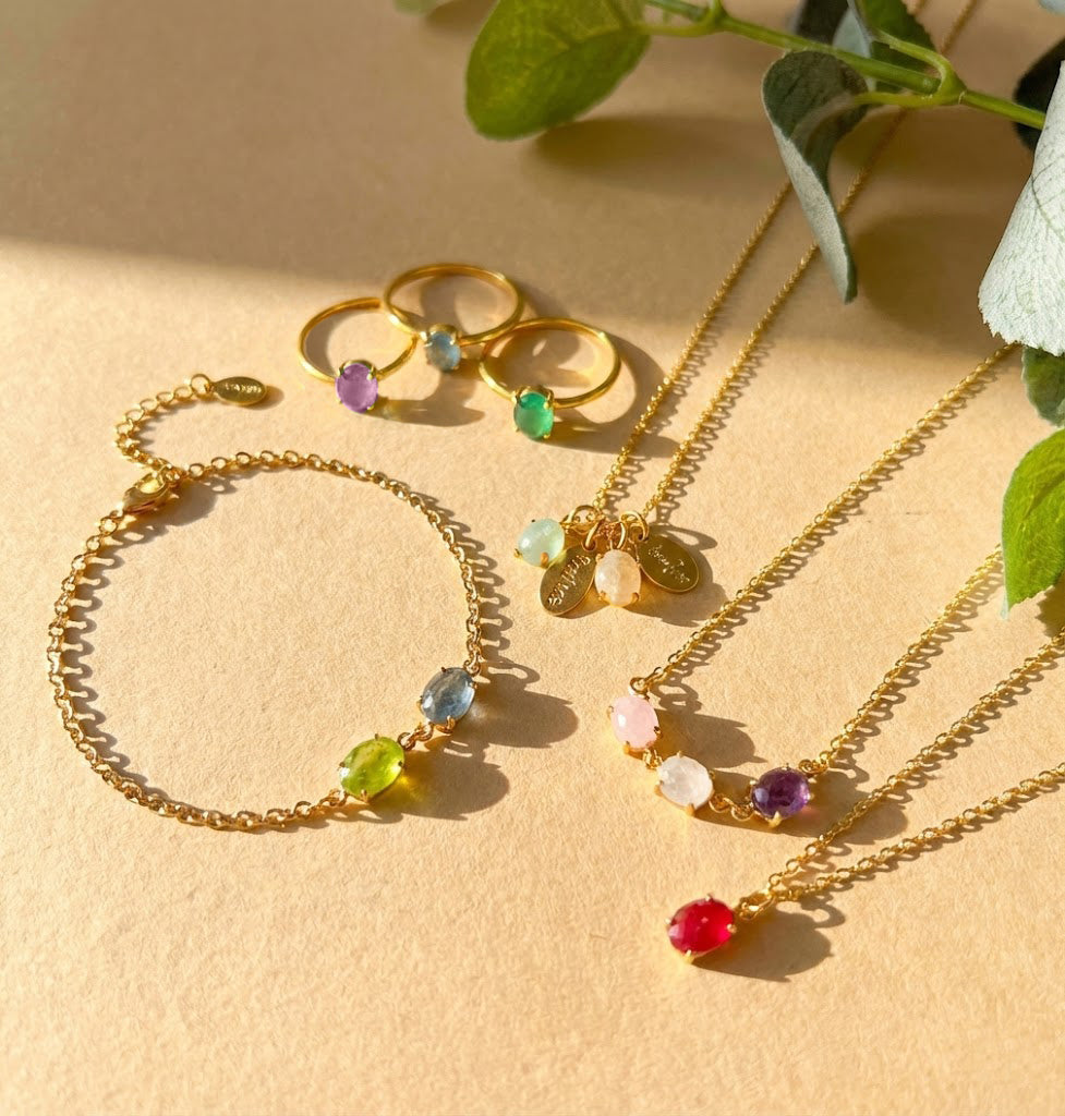 Colorful oval birthstone rings, necklaces and bracelets in gold vermeil