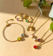 Colorful oval birthstone rings, necklaces and bracelets in gold vermeil