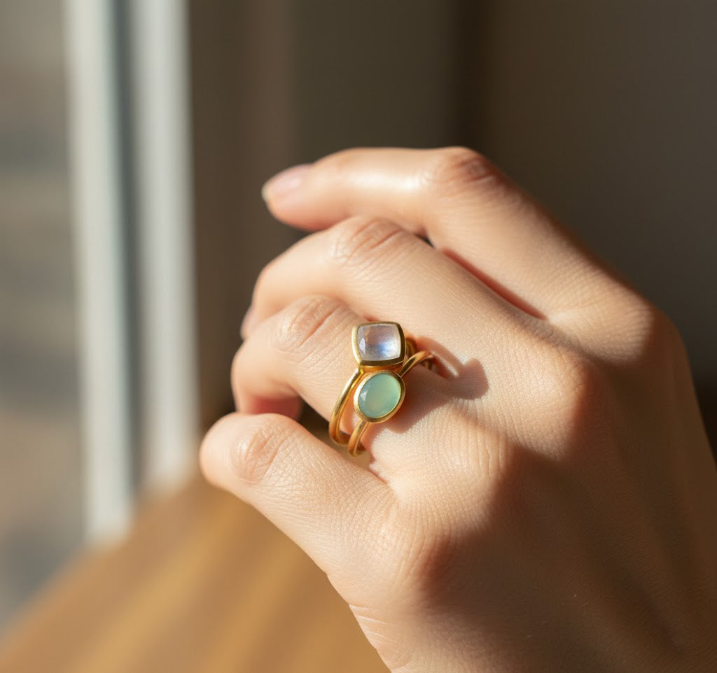 Stacked birthstone rings with oval and diamond shaped bezels in gold, custom gemstone rings available in all birthstones for layering