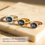 Mix-and-match oval birthstone rings sizing and color chart showing available gemstones and metals; build your own stack with kyanite (September) plus garnet, amethyst, aquamarine, citrine, peridot and more; choose sterling silver or 18k gold vermeil.