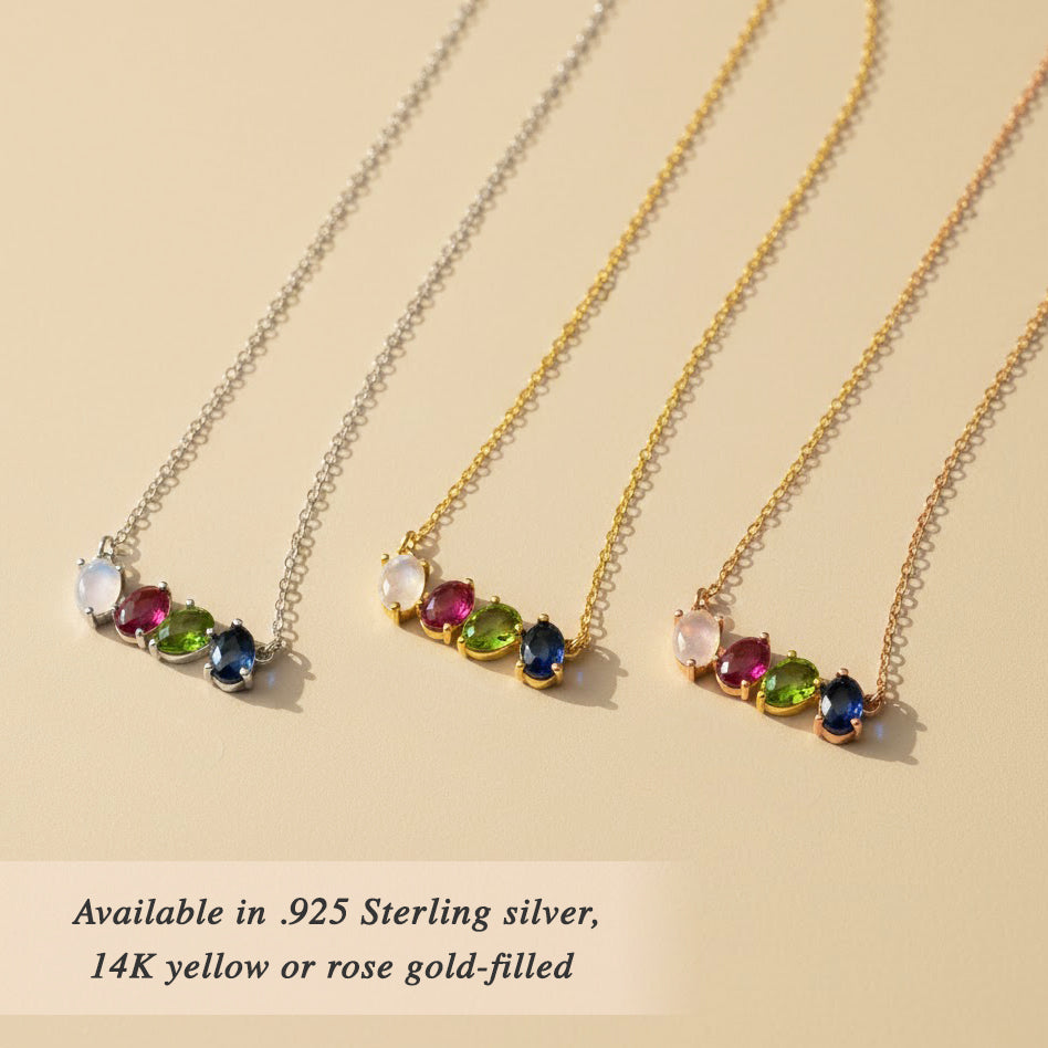 Multiple custom birthstone necklaces displayed together, showing different gemstone combinations for children or family members. Personalized family jewelry options designed for moms and grandmas.