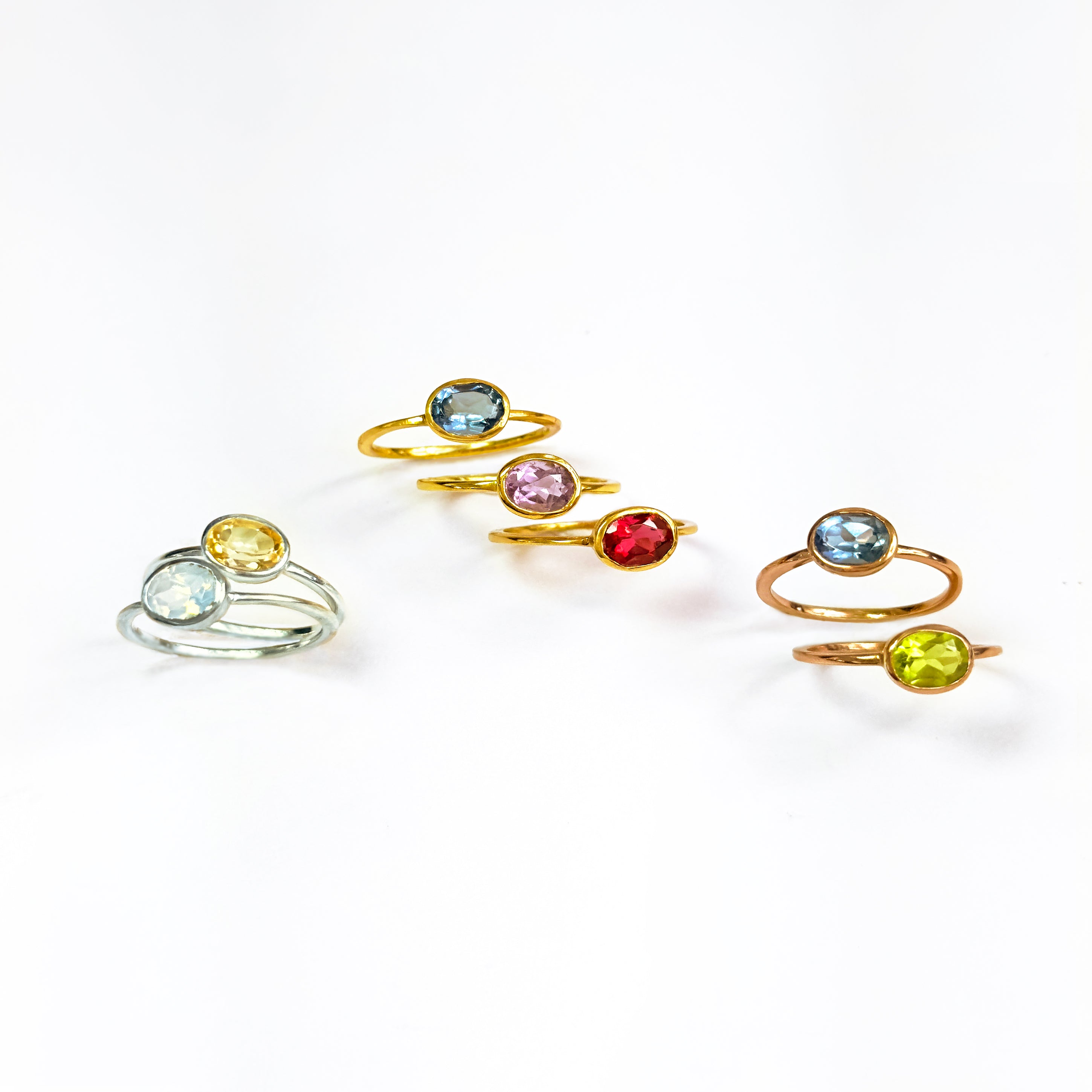 Small oval rings in sterling silver are citrine and moonstone, gold plated rings are blue topaz, purple amethyst, garnet; rose gold plated rings are kyanite and peridot. stack set, stacking rings, gemstone ring, birthstone ring, mother's day gift for her, gift for mom, gift for fiance, gift for girlfriend, wedding jewelry, bridesmaid jewelry, anniversary jewelry, anniversary gift, birthday gift, christmas gift, valentine's day gift, valentine's day rings, dainty ring, cocktail ring, statement ring, bezel 