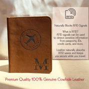 Personalized leather passport holder engraved with a monogram and “World Traveler” airplane design, made from premium 100% genuine cowhide leather. The product is shown in a warm natural light setting with text explaining RFID-blocking benefits. Ideal for travelers, this custom passport cover naturally absorbs RFID signals to protect sensitive data from passports, IDs, and credit cards. A perfect gift for men, groomsmen, or frequent flyers, combining style, security, and customization.