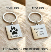 Personalized pet paw print keychain showing front and back engraving options, featuring a square stainless steel charm engraved with a dog paw print and pet name on the front and a custom message reading “Forever in my heart” on the back, attached to a durable silver keyring, custom pet memorial keychain gift for dog lovers, cat owners, pet parents, remembrance keepsake, handmade personalized pet loss gift, sympathy gift for pet owners, meaningful everyday accessory